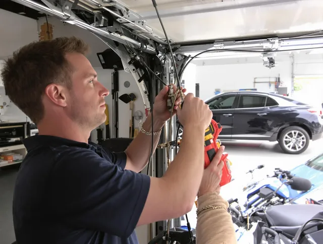 Rialto Garage Door Repair safety certified technician performing cable replacement in Rialto