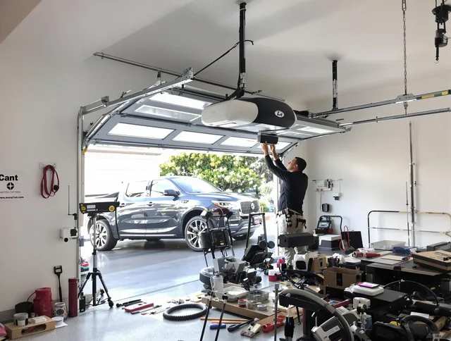 Rialto Garage Door Repair specialist installing smart garage door opener system in Rialto home